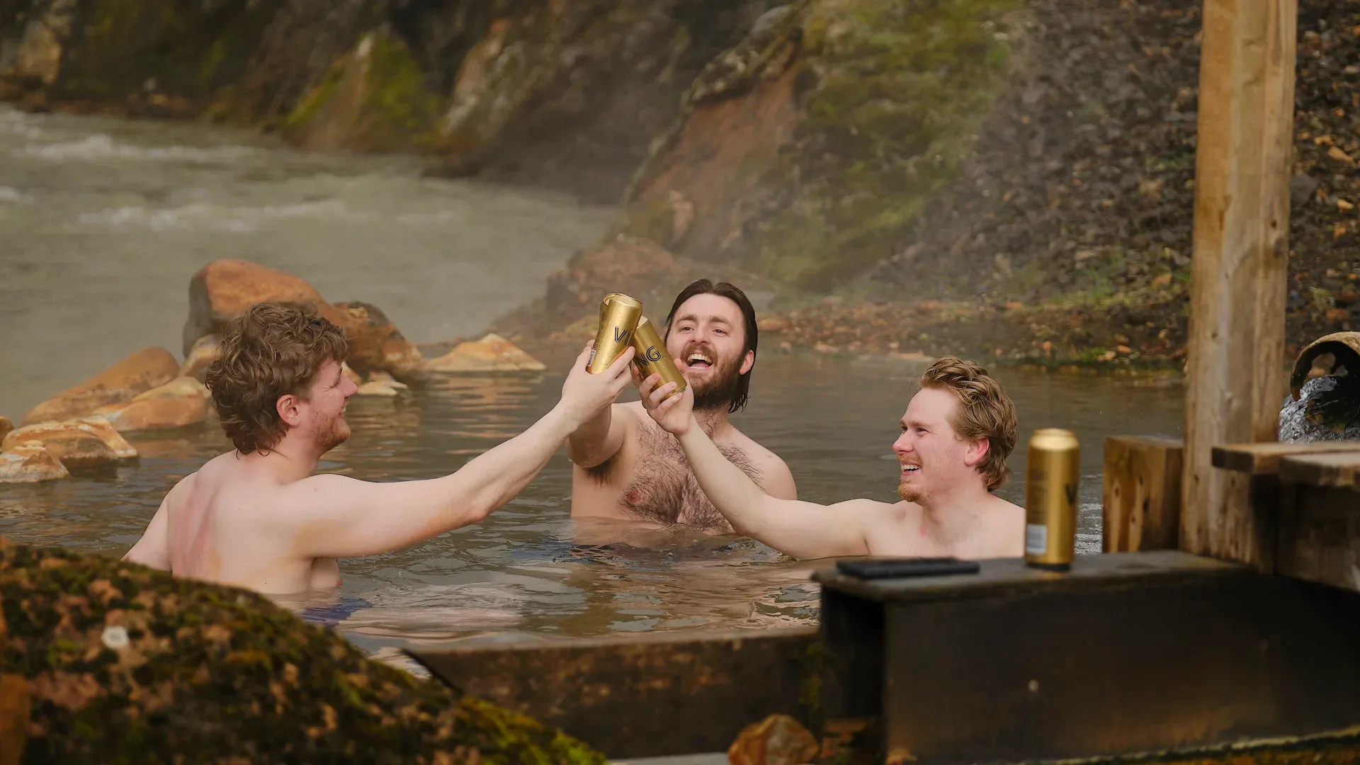 A man standing on a cliff overlooking Hrafntinnusker